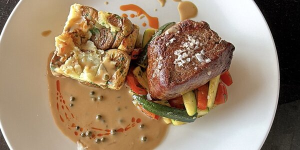 250g Fillet of beef -steak- with roast potatoes, cep mushroom sauce and baby vegetable