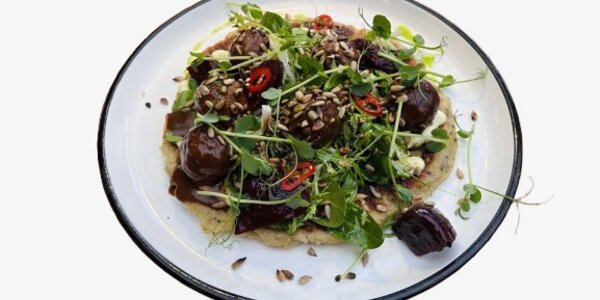 Meatballs served with potato fritter,