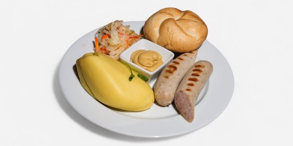 Homemade light fried pork sausage with a bun, side dish and salad of choice