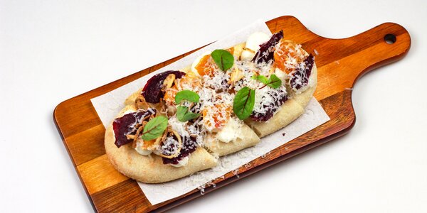 pizzetta with baked red and yellow beetroot,