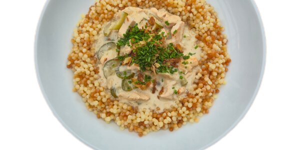 Chicken stroganoff with butter pasta rice nad crunchy onion,