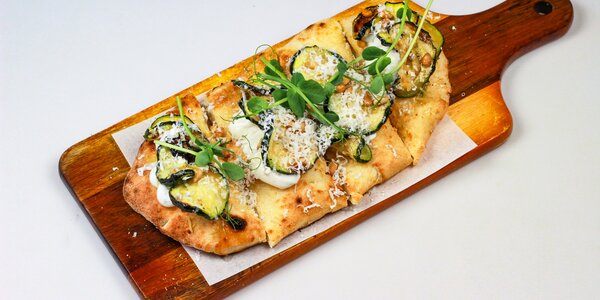 pizzetta with zucchini marinated in citrus fruit,